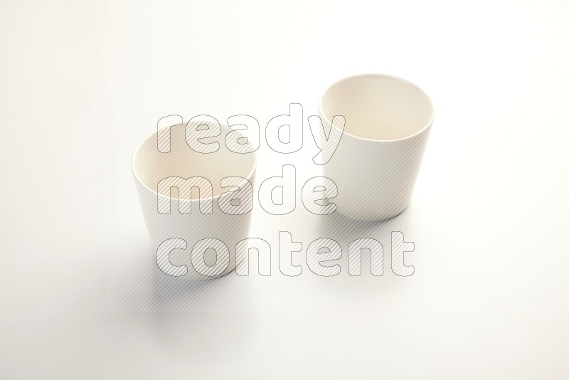 white ceramic cup on white countertop