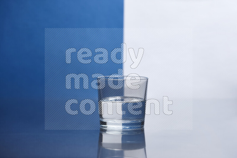 The image features a clear glassware filled with water, set against white and blue background