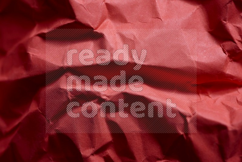 Crumpled craft paper on black background