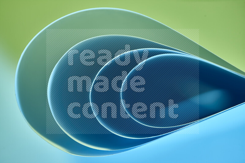 فن تجريدي لورق مطوي على شكل منحنيات ناعمة بتدرجات اللون الأخضر والأزرق