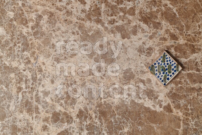 A decorative coaster on beige marble background