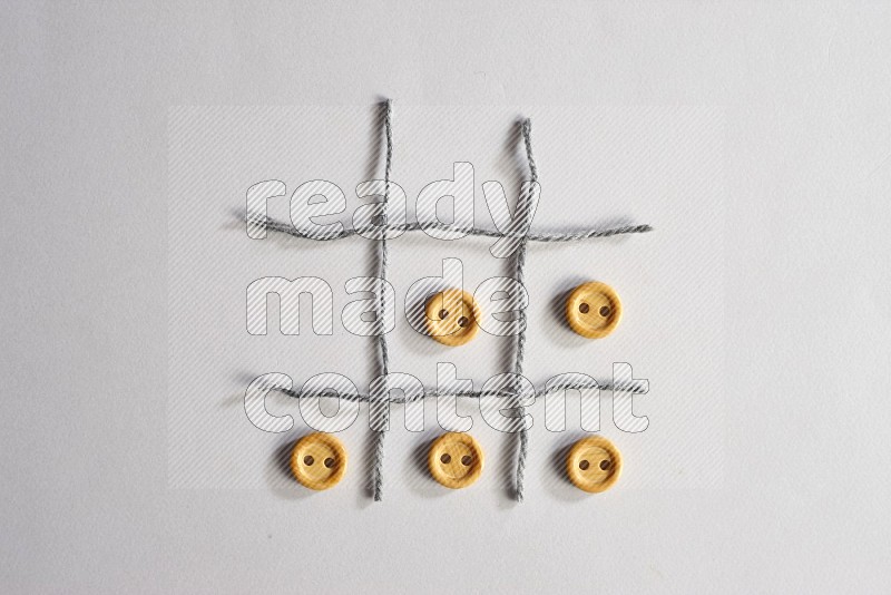 Wooden buttons on grey background