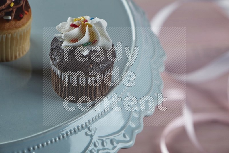 Chocolate mini cupcake topped with cream