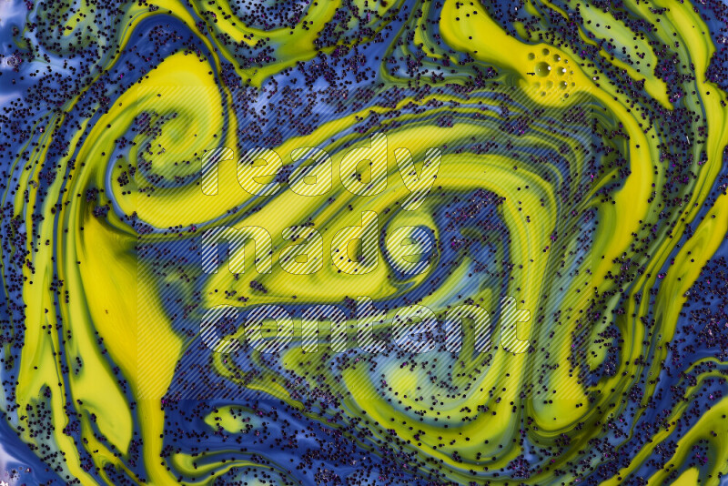 A close-up of sparkling purple glitter scattered on swirling blue and yellow background