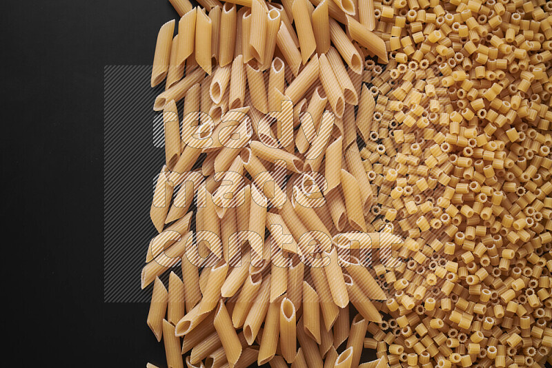 Different pasta types on black background