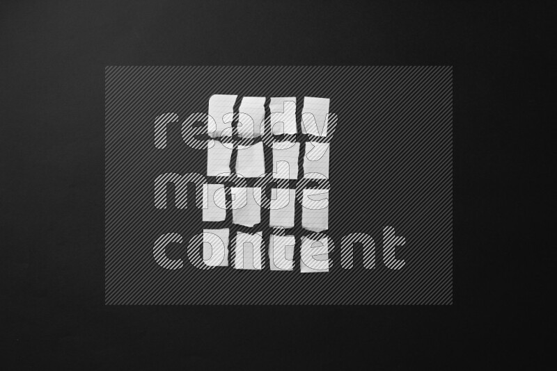 Ripped notebook sheet on black background