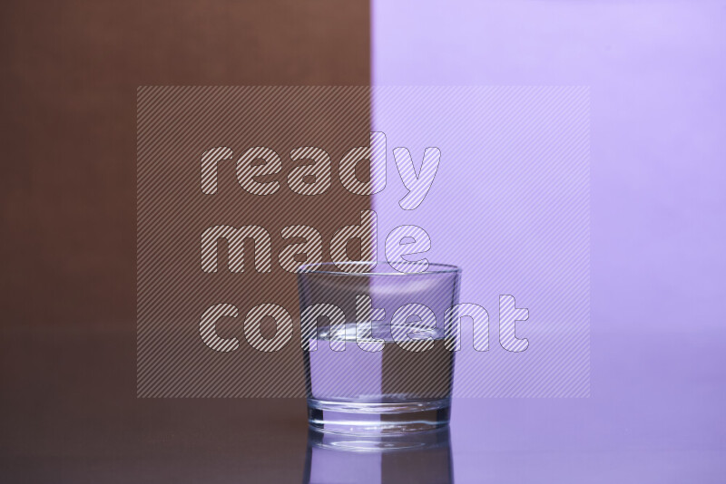 The image features a clear glassware filled with water, set against brown and light purple background