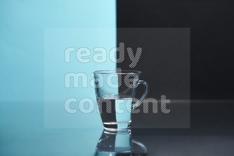 The image features a clear glassware filled with water, set against light blue and black background