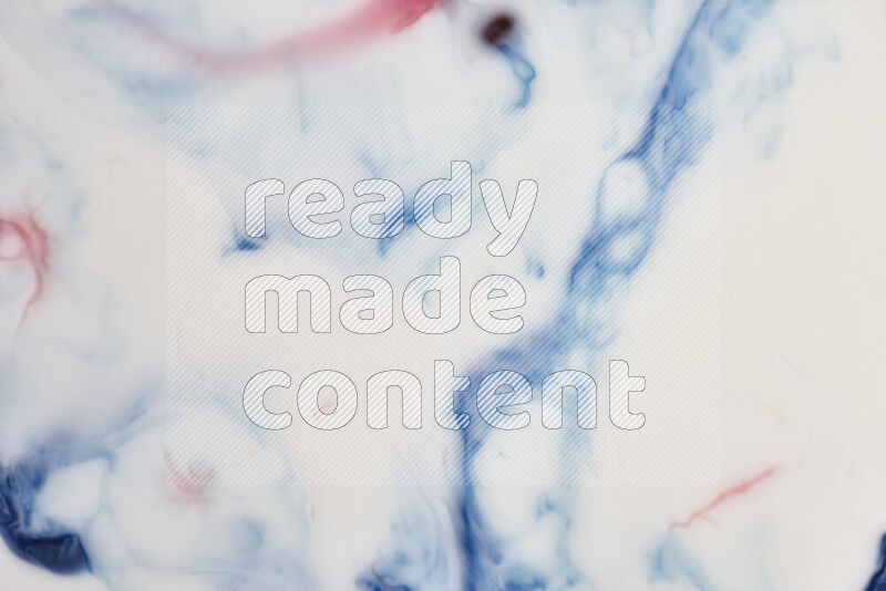 A close-up of abstract swirling patterns in blue, red and white