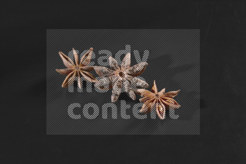 Star anise on black background