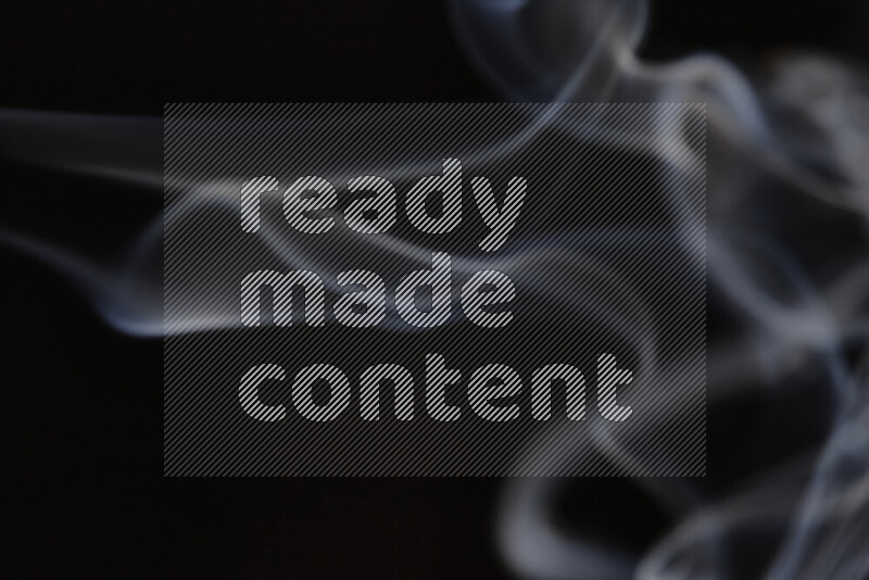 Motion of wavy smoke isolated on dark background
