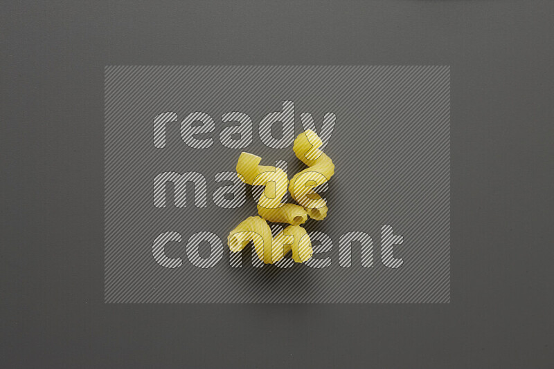 Twist pasta on grey background