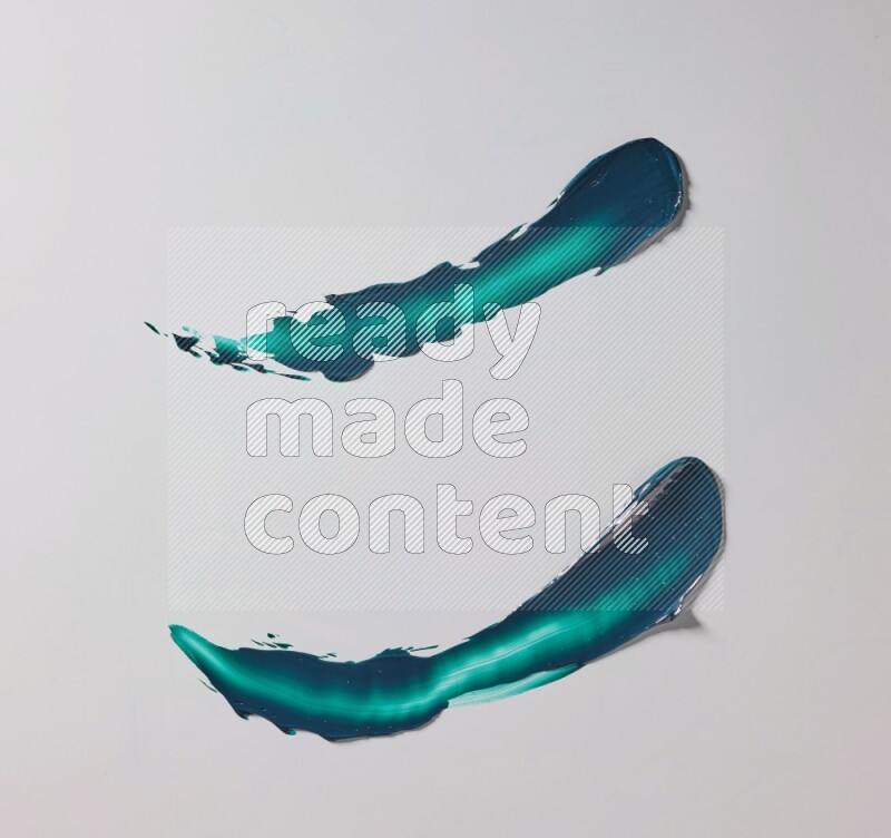 Turquoise curved painting knife strokes on white background