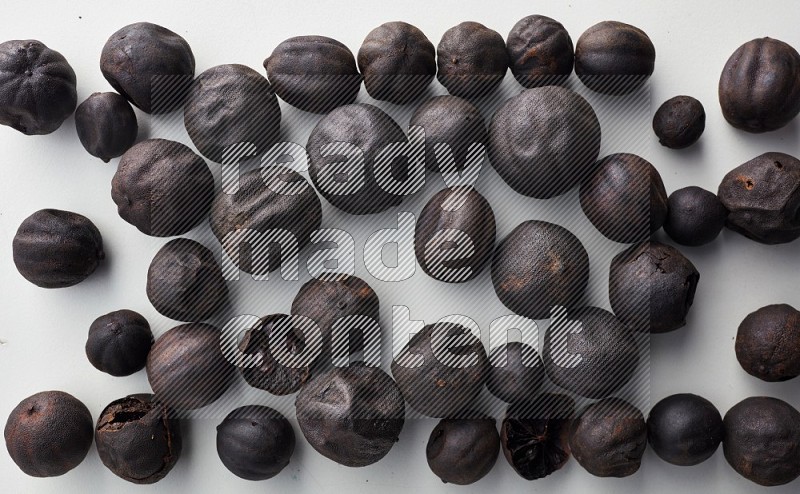 Top-view shot of dried lime (loomi) on white background