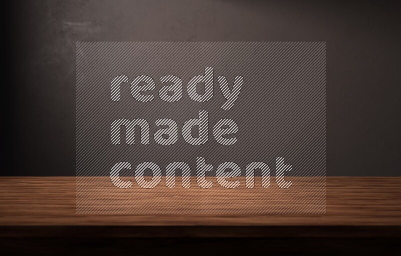 A wooden table top with colored textured wall background