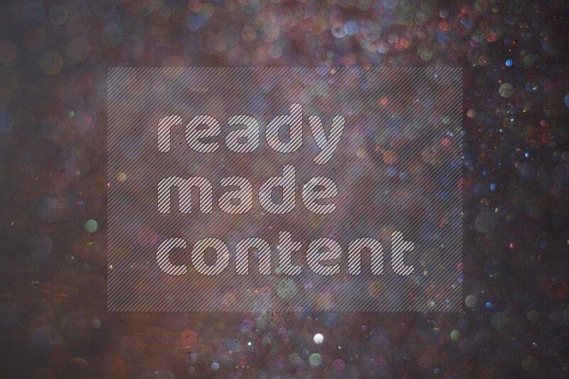 Multicolored glitter powder isolated on black background