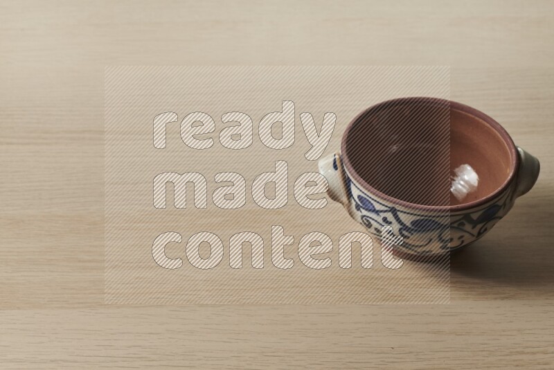 Multicolored Pottery Pot on Oak Wooden Flooring, 45 degrees