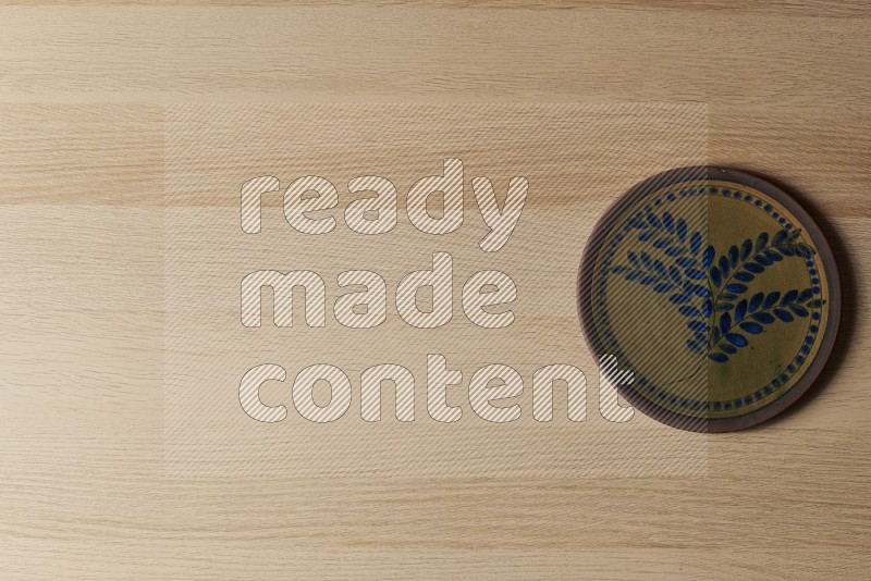 Top View Shot Of A Decorative Pottery Plate on Oak Wooden Flooring