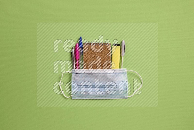School supplies on green background (Back to school)