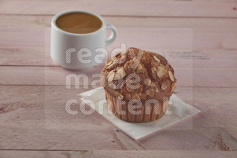 Almond cupcake on a wooden pink background
