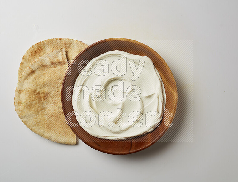 Plain Lebnah in a wooden plate on a white background