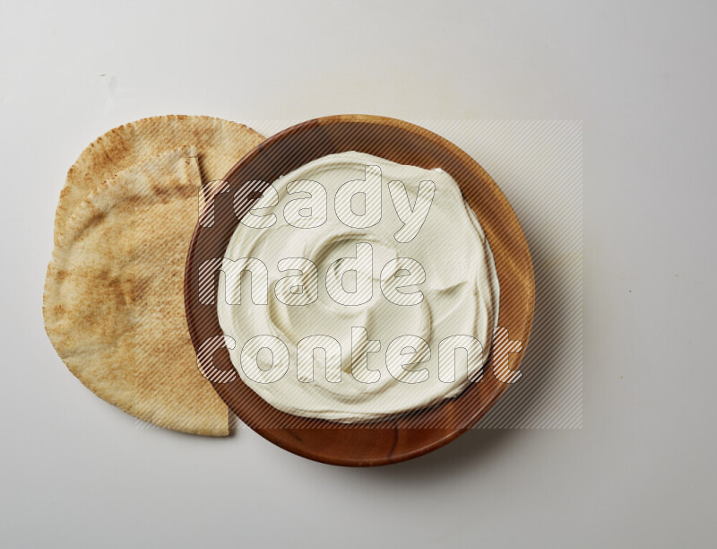 Plain Lebnah in a wooden plate on a white background