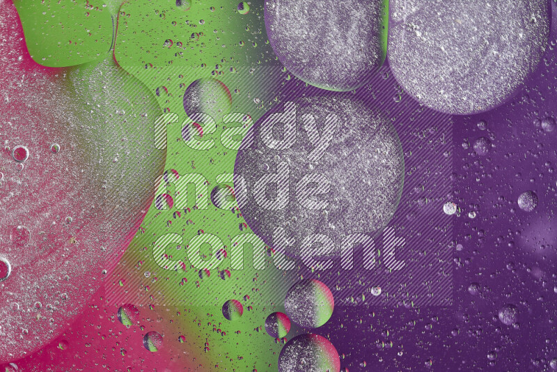 Close-ups of abstract oil bubbles on water surface in shades of purple, green and pink