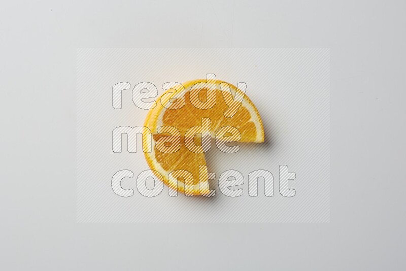 Two halves of an orange slices on white background