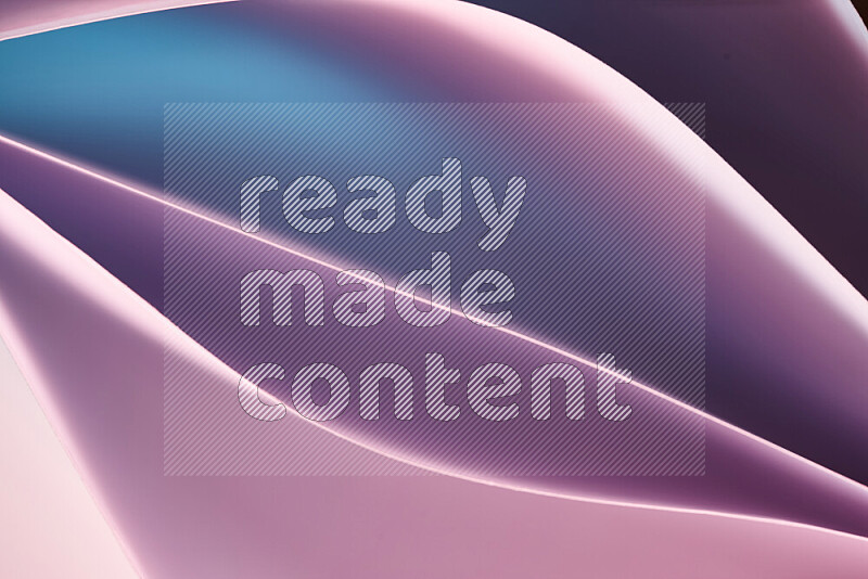This image showcases an abstract paper art composition with paper curves in blue, purlpe and pink gradients created by colored light