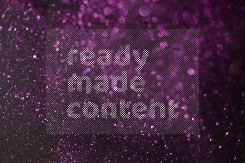 Pink glitter powder isolated on black background