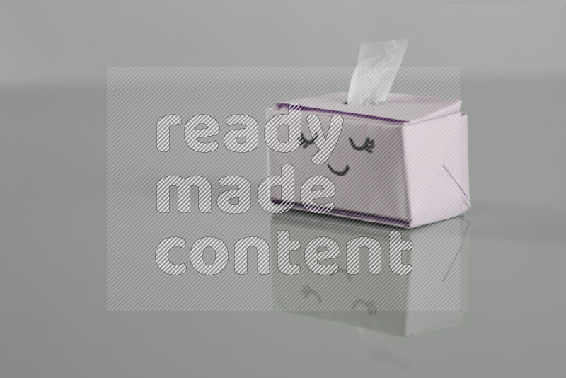 Origami tissue box on grey background