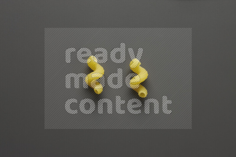 Twist pasta on grey background