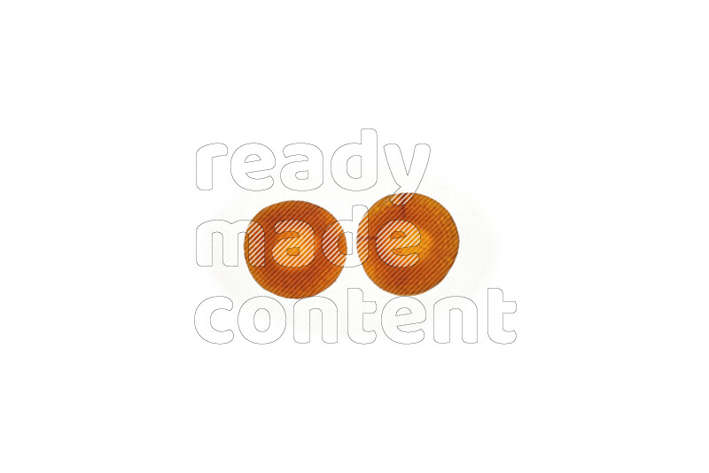 Carrots slices on illuminated white background