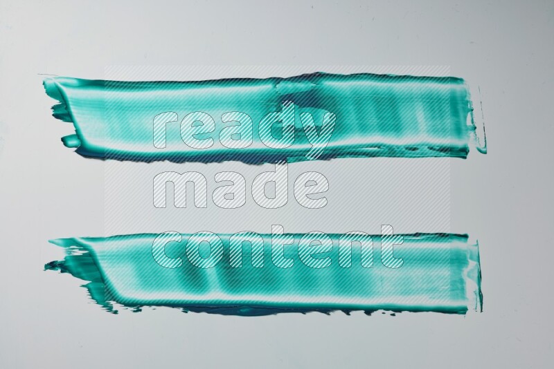 Turquoise painting knife strokes on white background