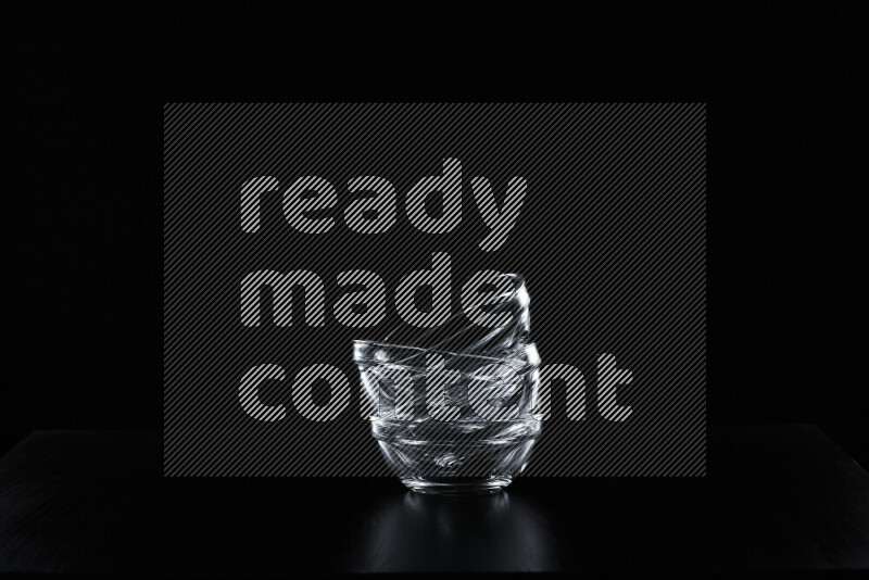 Glassware with rim light against black background