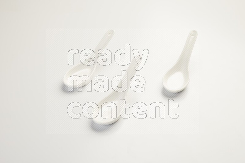 white ceramic soup spoon on white countertop