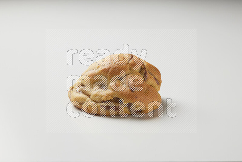 a chocolate chip cookie on a white background