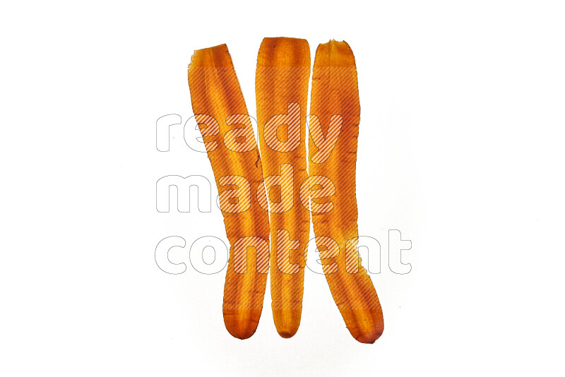 Carrots slices on illuminated white background