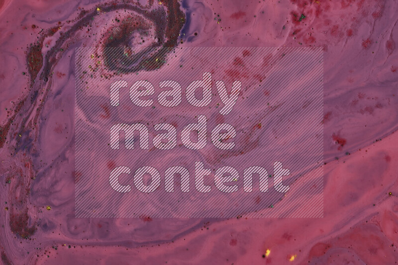 A close-up of abstract swirling patterns in red and blue with colored particles