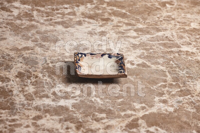 Decorative Pottery Plate on Beige Marble Flooring
