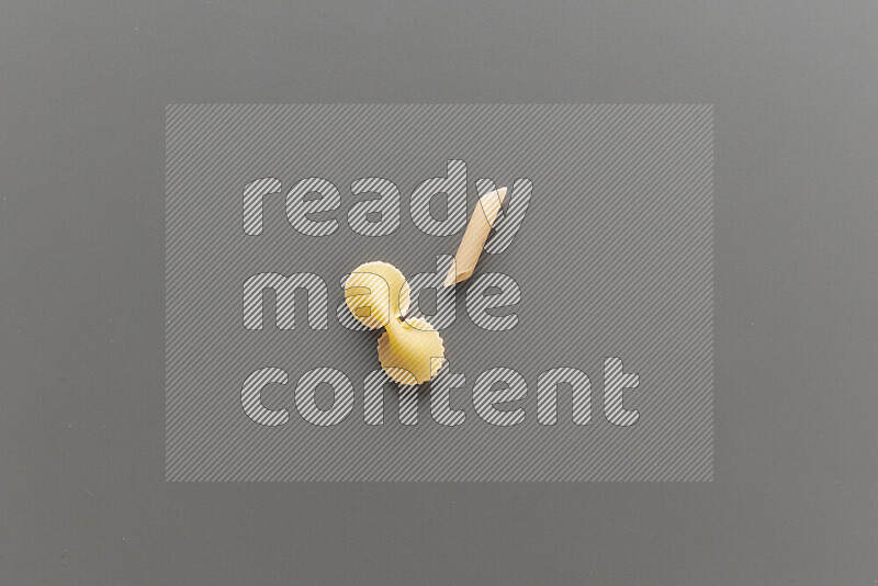 Fiocchi pasta with other types of pasta on grey background