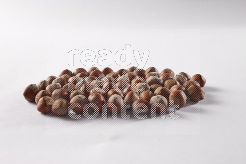 Hazelnuts on white background