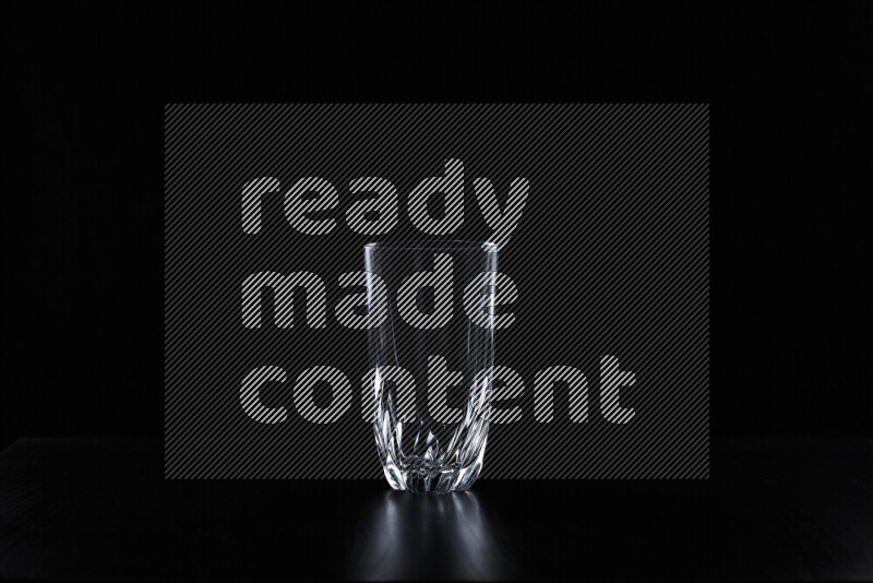 Glassware with rim light against black background