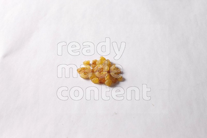 Raisins on white background