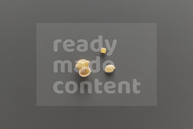 Different pasta types on grey background