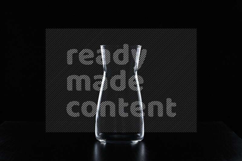 Glassware with rim light against black background