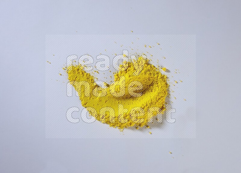 Yellow powder strokes on white background