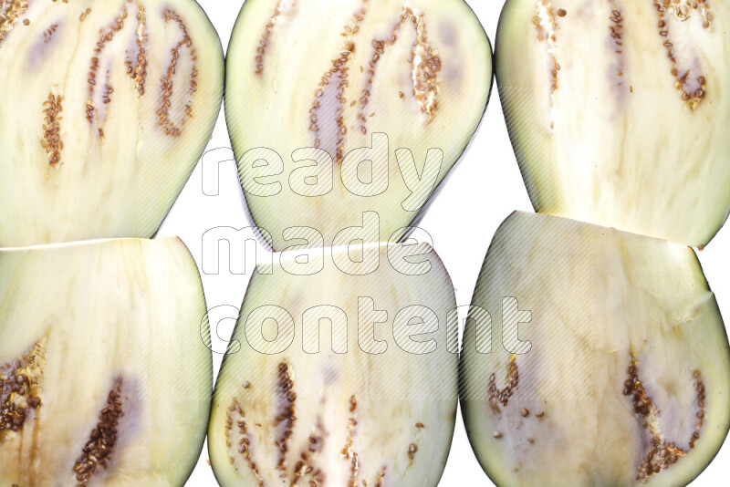 Eggplant slices on illuminated white background