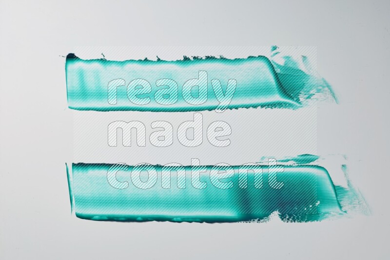 Turquoise painting knife strokes on white background