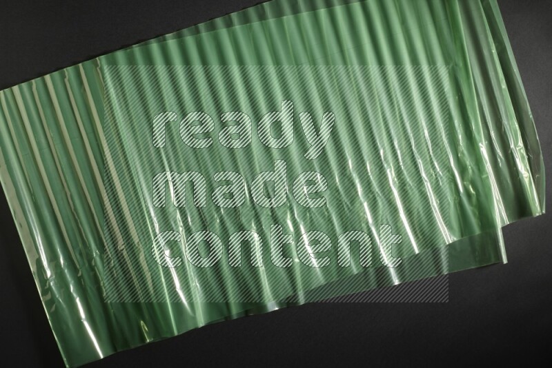 Colored plastic textures on black background